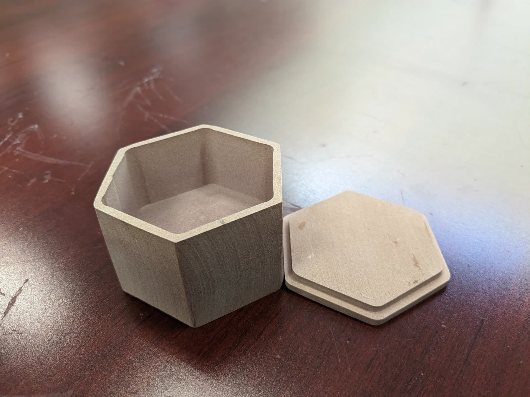 The finished HexBox, a six-sided milled container with its lid beside it